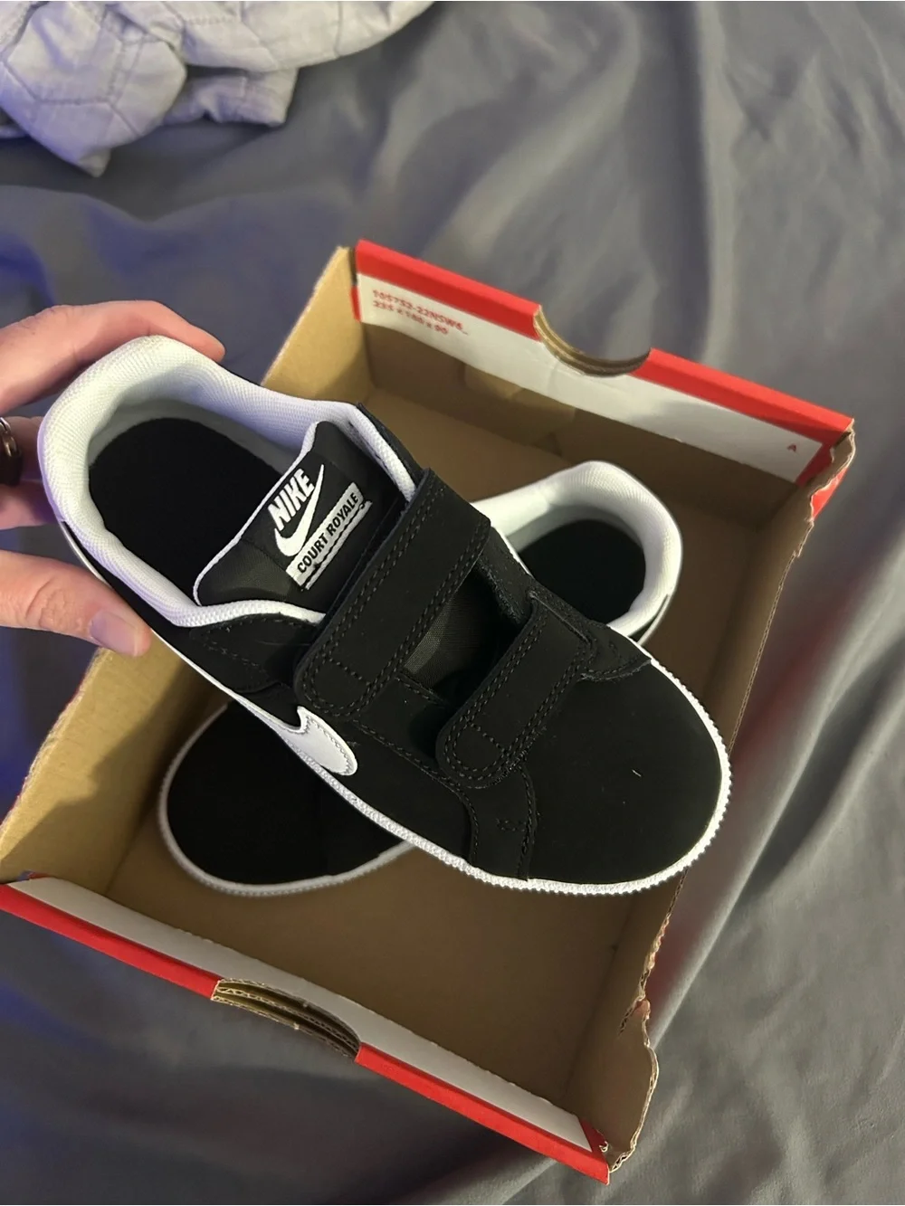 Nike Black/White youth shoes.